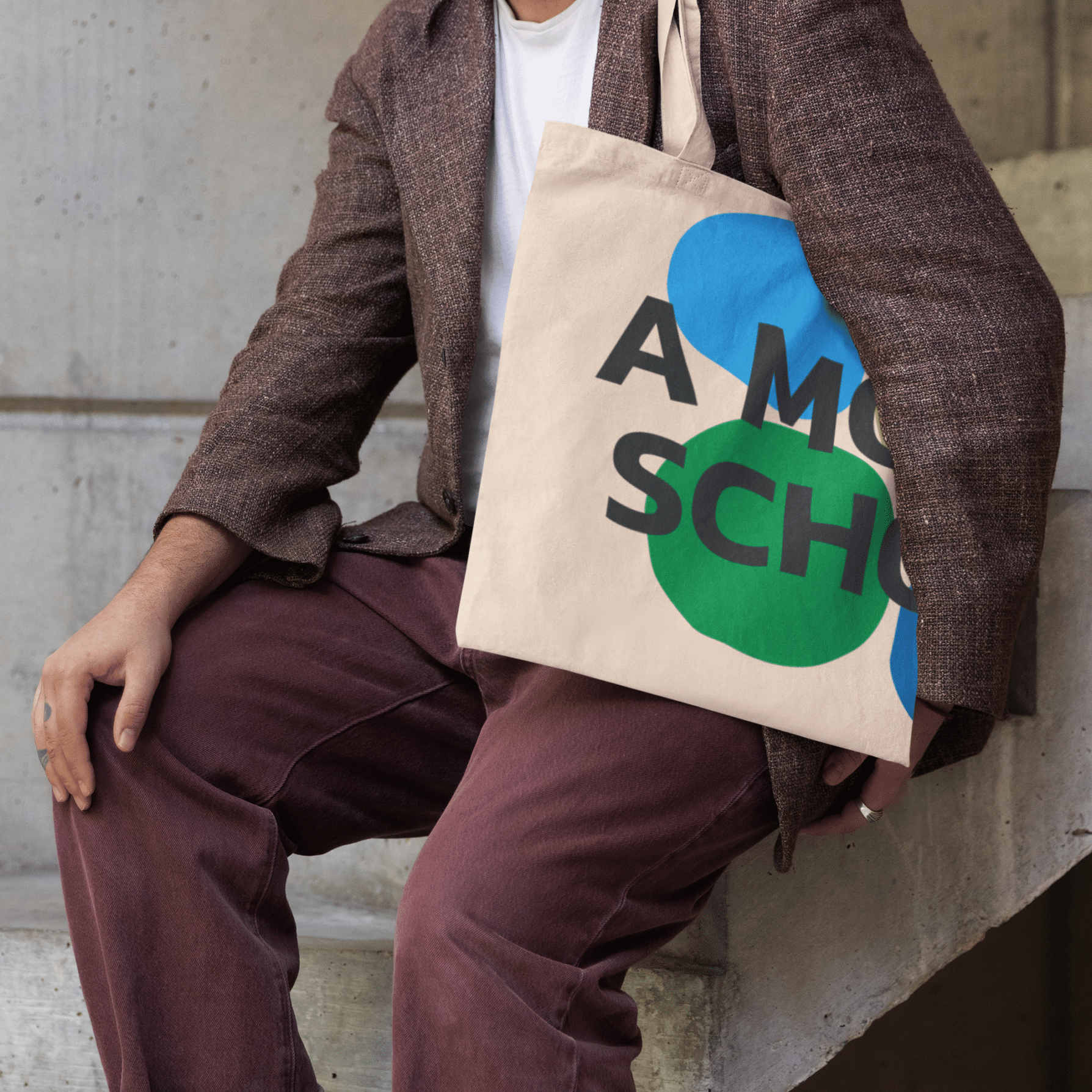 tote-bag-mockup-featuring-a-cropped-face-person-sitting-on-a-staircase-m39801